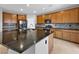 Spacious kitchen with granite countertops, stainless steel appliances, and a center island at 2832 Aragon Terrace Way, Henderson, NV 89044