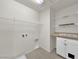 Laundry room featuring built in shelving, upper cabinets, and laundry hookups at 2832 Aragon Terrace Way, Henderson, NV 89044