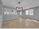Bright living room with recessed lighting, tile floors, and a modern chandelier at 2832 Aragon Terrace Way, Henderson, NV 89044