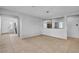 Bright open concept living room with tile flooring, neutral walls and lots of sunlight at 2832 Aragon Terrace Way, Henderson, NV 89044
