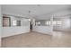 Spacious living room featuring tile flooring, neutral paint, modern lighting and bright windows at 2832 Aragon Terrace Way, Henderson, NV 89044