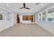 Spacious open-concept living room adjacent to the kitchen with neutral colors at 2832 Aragon Terrace Way, Henderson, NV 89044