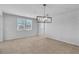 Bright living room with tile flooring, neutral walls, modern lighting and bright windows at 2832 Aragon Terrace Way, Henderson, NV 89044