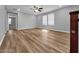 Spacious open loft featuring wood-look floors, neutral paint and modern ceiling fan at 2832 Aragon Terrace Way, Henderson, NV 89044