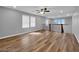 Bright and open loft space with wood-look flooring, a ceiling fan, and modern railing at 2832 Aragon Terrace Way, Henderson, NV 89044
