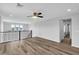 Comfortable loft area with laminate floors and railing at 2832 Aragon Terrace Way, Henderson, NV 89044