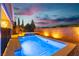 Beautiful backyard pool and hot tub with privacy wall and sunset view in a well maintained yard at 2832 Aragon Terrace Way, Henderson, NV 89044