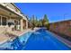 Private backyard featuring a pool and mature landscaping at 2832 Aragon Terrace Way, Henderson, NV 89044