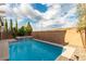 Inviting pool and spa in a private backyard with mountain views in the distance at 2832 Aragon Terrace Way, Henderson, NV 89044