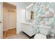 Stylish bathroom featuring a modern vanity and uniquely tiled accent wall for a contemporary design at 3007 La Mesa Dr, Henderson, NV 89014