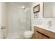 Bathroom featuring a modern glass shower, wood vanity and natural light at 3007 La Mesa Dr, Henderson, NV 89014