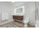 Modern bathroom with marble accents, a floating vanity, and sleek fixtures, offering a spa-like experience at 3007 La Mesa Dr, Henderson, NV 89014