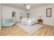 Serene bedroom featuring a plush bed, soothing colors, and arched windows overlooking peaceful outdoor views at 3007 La Mesa Dr, Henderson, NV 89014