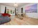 Large room with comfortable seating and patio access featuring great natural light at 3007 La Mesa Dr, Henderson, NV 89014
