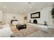 Spacious living room with fireplace, modern furniture, neutral color palette and large rug at 3007 La Mesa Dr, Henderson, NV 89014