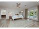A main bedroom with light wood floors, neutral decor and private access to the backyard pool at 3007 La Mesa Dr, Henderson, NV 89014