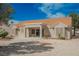 Low maintenance backyard featuring a covered patio with desert-friendly landscaping and mature trees at 3116 Richland Dr, Las Vegas, NV 89134