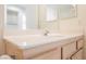 Well-maintained bathroom vanity featuring a neutral countertop and light wood cabinetry at 3116 Richland Dr, Las Vegas, NV 89134