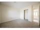 Clean bedroom featuring neutral carpet and a bright closet for a cozy atmosphere at 3116 Richland Dr, Las Vegas, NV 89134