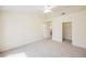 A bedroom with neutral carpet, closet and a doorway leading to the bathroom at 3116 Richland Dr, Las Vegas, NV 89134