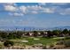 Panoramic view of the city skyline over lush golf course, offering the best of both worlds at 3116 Richland Dr, Las Vegas, NV 89134