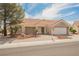 Lovely single-story home with a well-maintained front yard and a convenient attached two-car garage at 3116 Richland Dr, Las Vegas, NV 89134