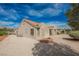 Charming home exterior with tile roof, low-maintenance landscaping, and stucco finish under a bright sky at 3116 Richland Dr, Las Vegas, NV 89134