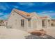 Side view of single-story house with desert landscaping, offering a glimpse of its architectural design and surrounding environment at 3116 Richland Dr, Las Vegas, NV 89134