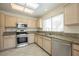 Modern kitchen with stainless steel appliances and granite countertops at 3116 Richland Dr, Las Vegas, NV 89134