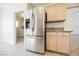 Modern kitchen with stainless steel refrigerator and light wood cabinetry at 3116 Richland Dr, Las Vegas, NV 89134