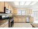 Modern kitchen with stainless steel appliances and granite countertops at 3116 Richland Dr, Las Vegas, NV 89134