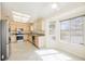 Bright kitchen features stainless steel appliances, tile flooring, and ample natural light from large windows at 3116 Richland Dr, Las Vegas, NV 89134
