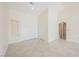 Expansive living room featuring neutral tile flooring and a high ceiling, bathed in natural light at 3116 Richland Dr, Las Vegas, NV 89134
