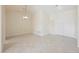 Bright open-concept living space with tile flooring, pendant lighting, and arched doorway at 3116 Richland Dr, Las Vegas, NV 89134