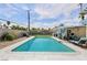 Backyard with a sparkling pool and patio area, designed for outdoor relaxation and enjoyment, with mature landscaping at 3140 Sundown Dr, Las Vegas, NV 89169