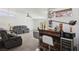 Basement bar area with vintage decor, barstools, and modern wine refrigerator at 3140 Sundown Dr, Las Vegas, NV 89169