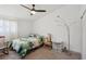Bedroom with ceiling fan, large bed, and decorative floor lamp at 3140 Sundown Dr, Las Vegas, NV 89169