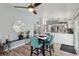 Modern dining area adjacent to the kitchen, with laminate floors and open floor plan at 3140 Sundown Dr, Las Vegas, NV 89169