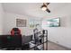 Bright office space with a ceiling fan, a window for natural light, and wall-mounted TV at 3140 Sundown Dr, Las Vegas, NV 89169