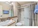 Clean bathroom with shower and sink and blue towels at 3151 Soaring Gulls Dr # 1201, Las Vegas, NV 89128