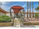 Welcoming entrance to the condo building, featuring manicured landscaping and a covered walkway at 3151 Soaring Gulls Dr # 1201, Las Vegas, NV 89128