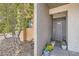 Charming condo front door with potted plants, creating an inviting entrance at 3151 Soaring Gulls Dr # 1201, Las Vegas, NV 89128