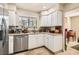 Charming kitchen featuring white cabinets, stainless steel appliances, and tile flooring at 3151 Soaring Gulls Dr # 1201, Las Vegas, NV 89128