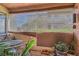 Cozy patio featuring privacy shades, comfortable seating, and potted plants at 3151 Soaring Gulls Dr # 1201, Las Vegas, NV 89128