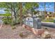 Attractive community signage for Desert Shores Villas Condominiums, set amidst well-maintained landscaping at 3151 Soaring Gulls Dr # 1201, Las Vegas, NV 89128