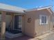 Exterior side view of the residence showcasing the entrance, siding, and landscaping at 3451 Ramona Ln, Pahrump, NV 89048