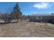 Exterior view of house featuring tan siding, minimal landscaping and a gravel yard at 3451 Ramona Ln, Pahrump, NV 89048