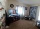 The living room has neutral walls and carpet, and decorative shelving to the left at 3451 Ramona Ln, Pahrump, NV 89048