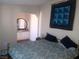 Bedroom showcasing a bed with quilt and ensuite bathroom with vanity at 3451 Ramona Ln, Pahrump, NV 89048