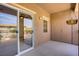 Private balcony with glass door and garden view. Decorative hanging plants included at 3825 Ormond Beach St # 203, Las Vegas, NV 89129